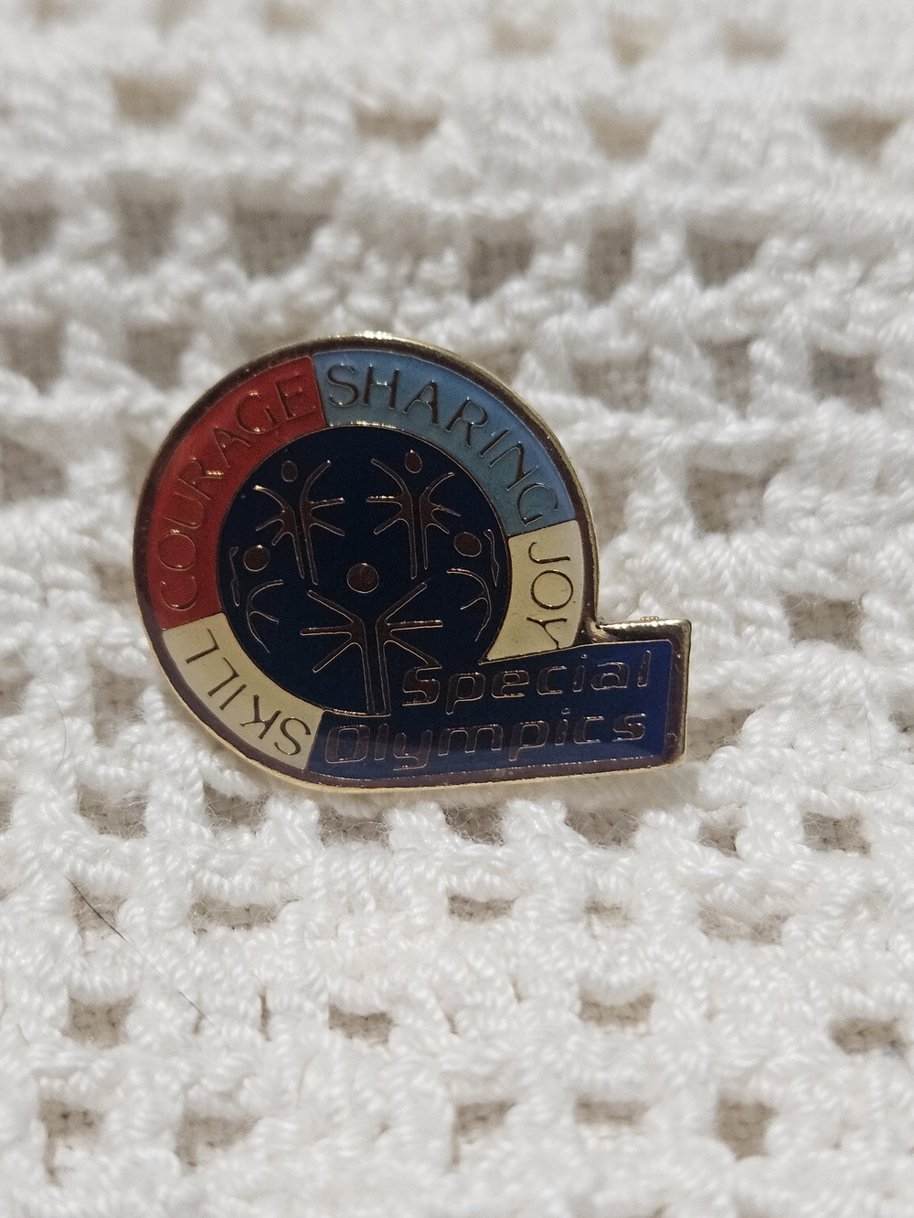 Special Olympics Enamel lapel pin It features motto "Skill Courage Sharing Joy"